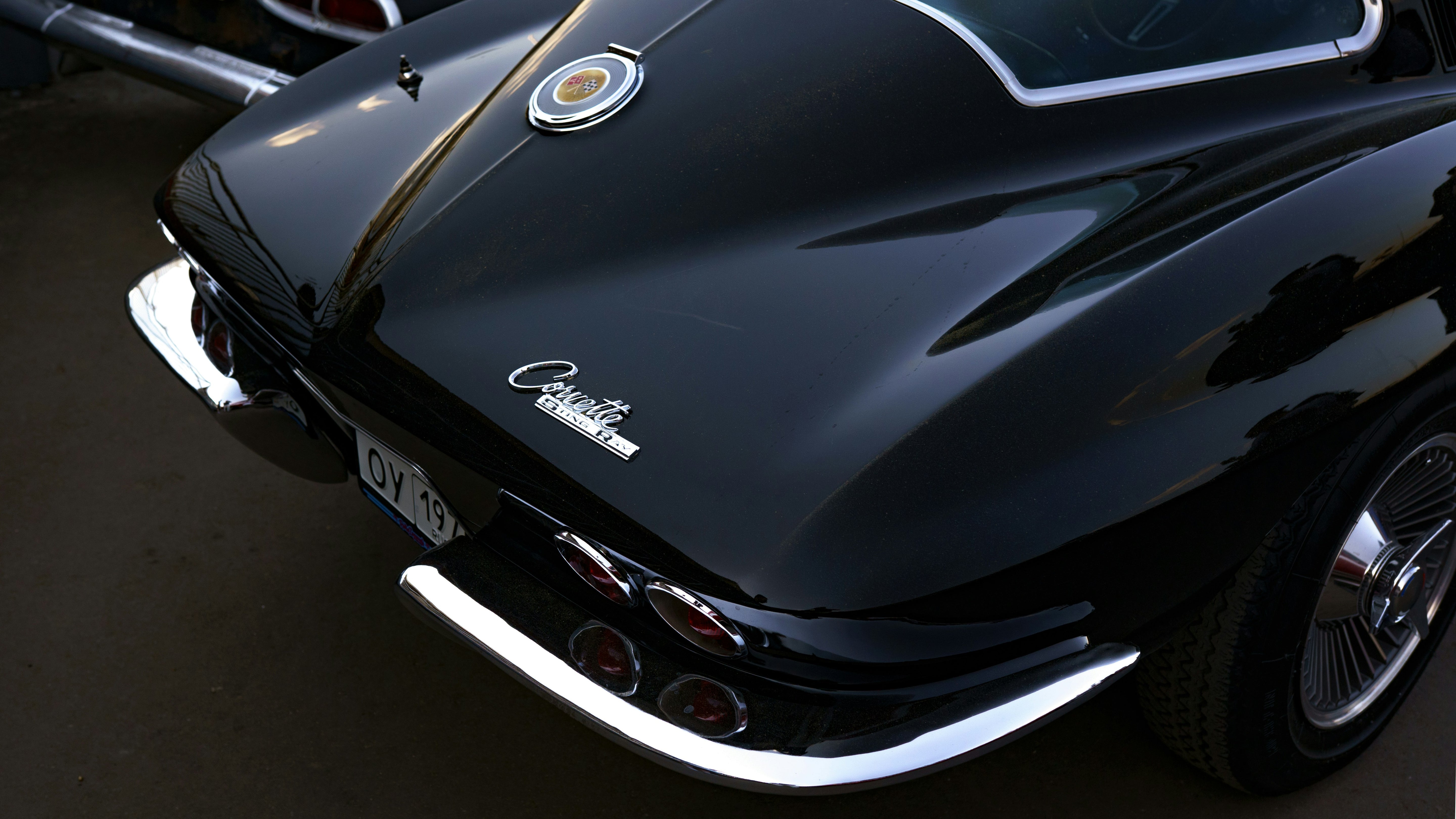 Close-up of a black Corvette Stingray on a dark background